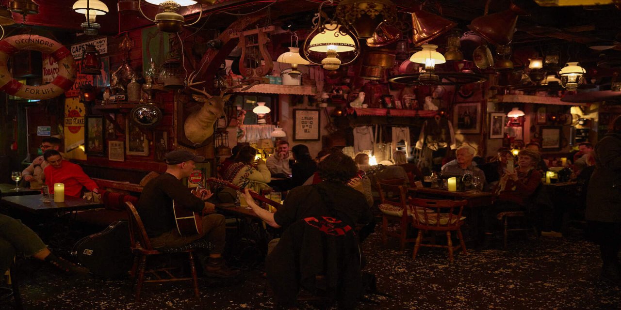 busy pub setting with yellow lighting