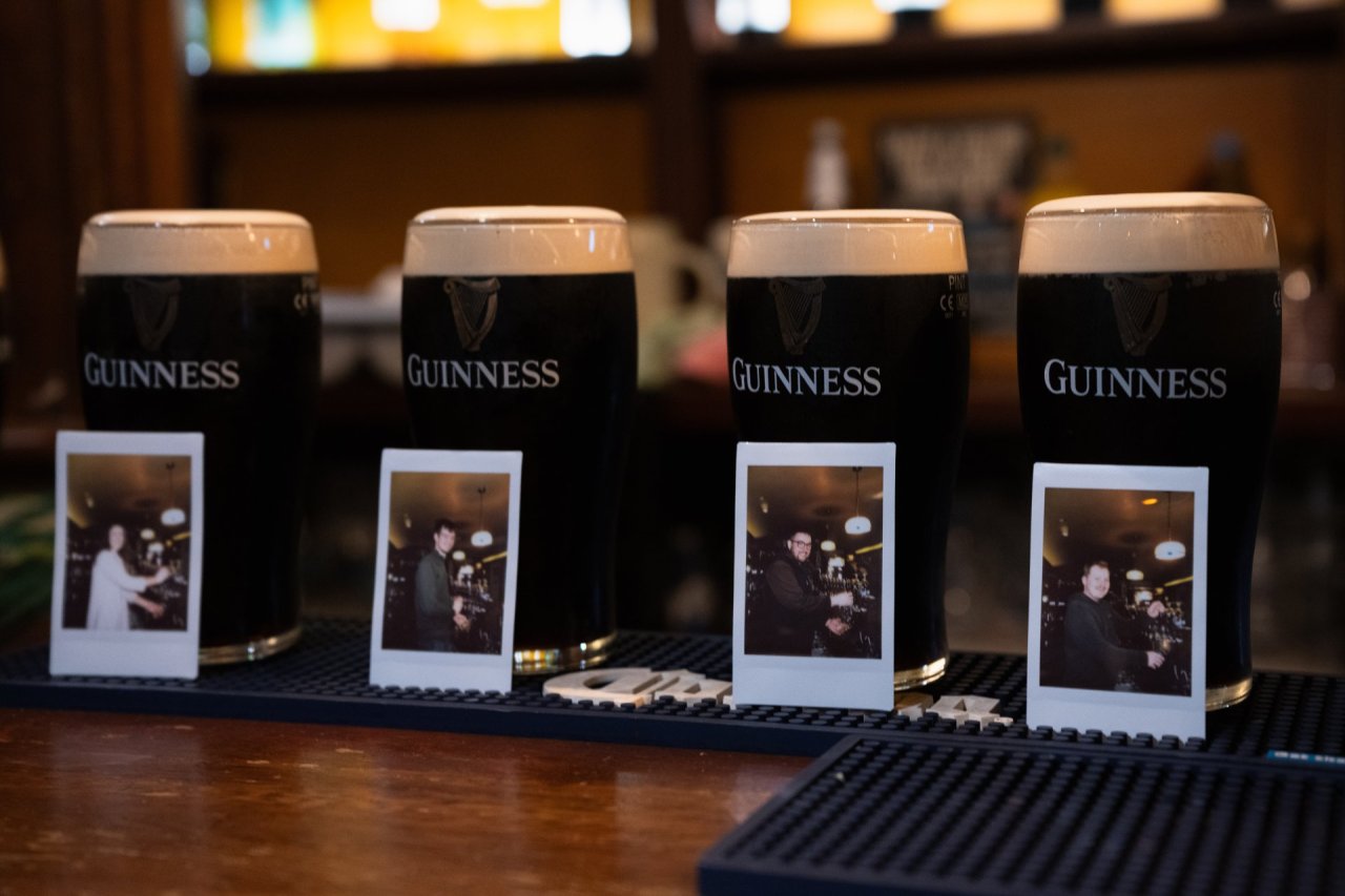 Polaroid pictures with pints of Guinness