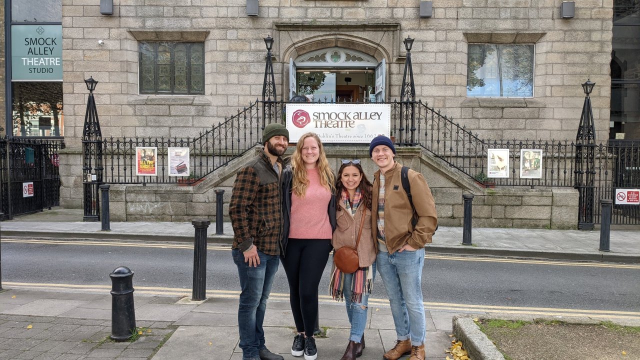 group of people standing outside of smock alley theatre